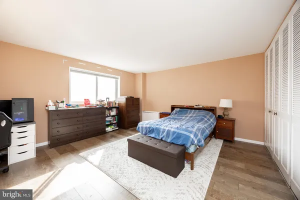 a bed room with a bed and a television
