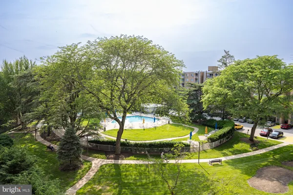 a view of a swimming pool with an outdoor space and seating area