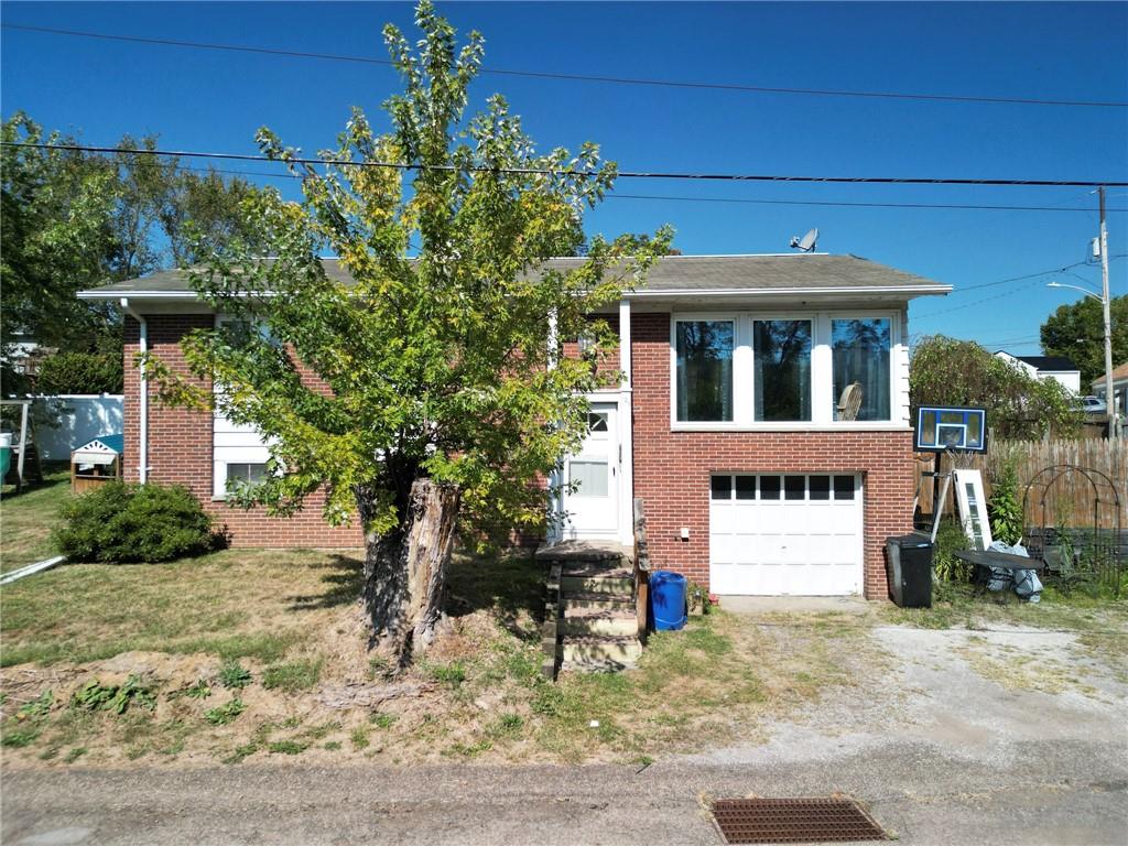 126 Chestnut Street Aliquippa, PA 15001 - Photo 1 of 22 a front view of a house with a yard
