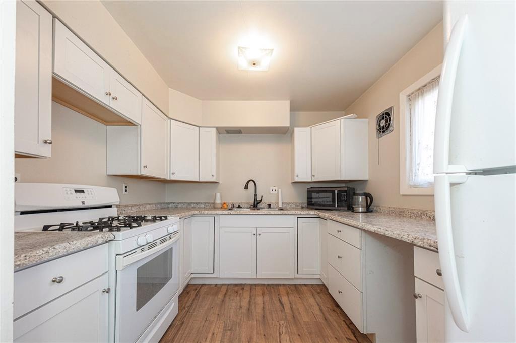 126 Chestnut Street Aliquippa, PA 15001 - Photo 3 of 22 a kitchen with cabinets appliances a sink and a counter top space