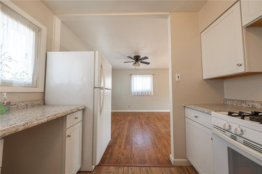 126 Chestnut Street Aliquippa, PA 15001 - Photo 4 of 22 a kitchen with a sink a refrigerator and window