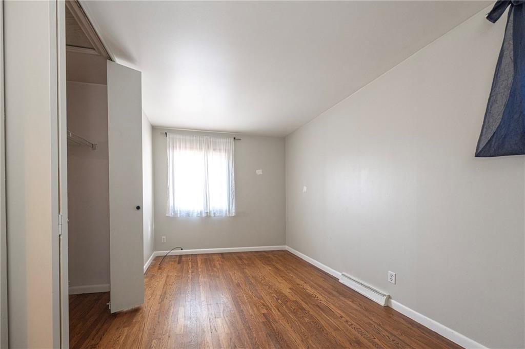 126 Chestnut Street Aliquippa, PA 15001 - Photo 7 of 22 an empty room with wooden floor and windows