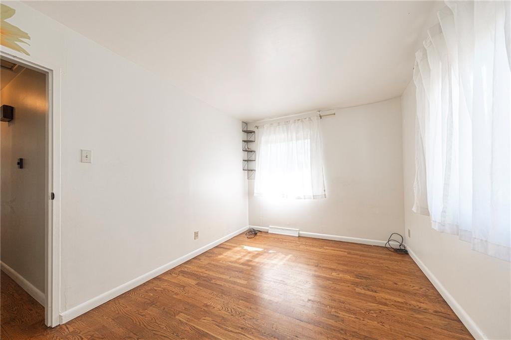 126 Chestnut Street Aliquippa, PA 15001 - Photo 10 of 22 an empty room with wooden floor and windows