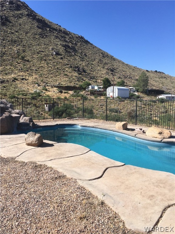 4238 West Ranch Road Golden Valley, AZ 86413 - Photo 4 of 45 a view of a swimming pool with a lake view