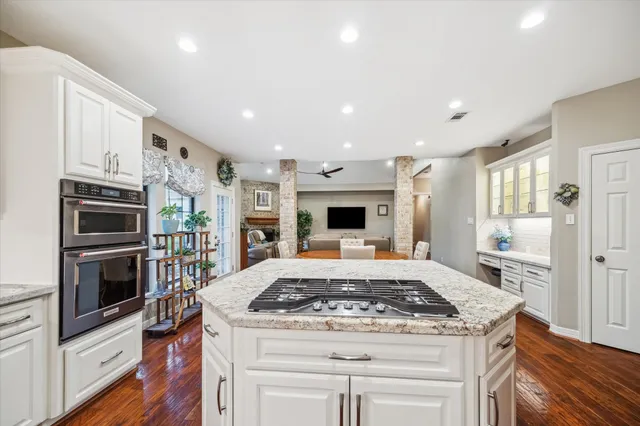 a kitchen with a stove and a refrigerator