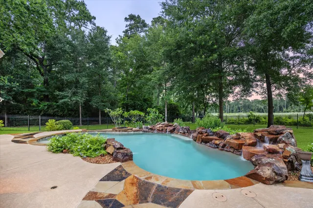an outdoor space with furniture and garden