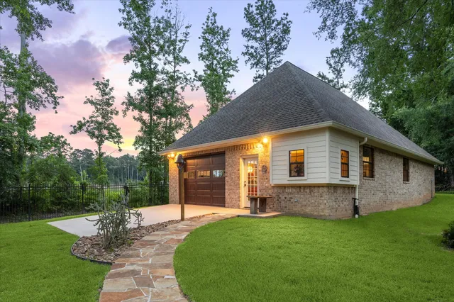 a front view of house with yard and green space