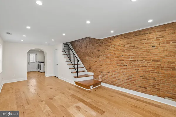 a view of an empty room with stairs