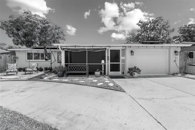 a view of a house with backyard