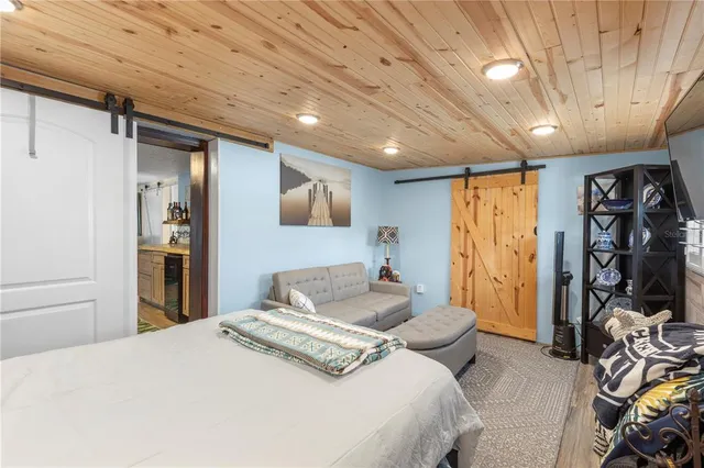 a bedroom with a bed and a walk in closet