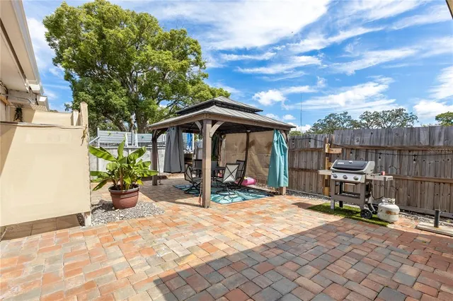 a view of a backyard with sitting area