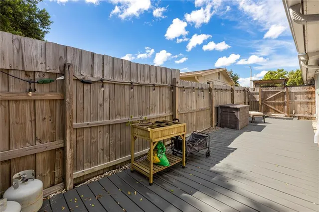 a patio with table and chairs