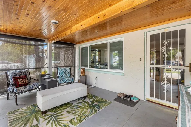 a backyard of a house with barbeque oven fire pit and outdoor seating