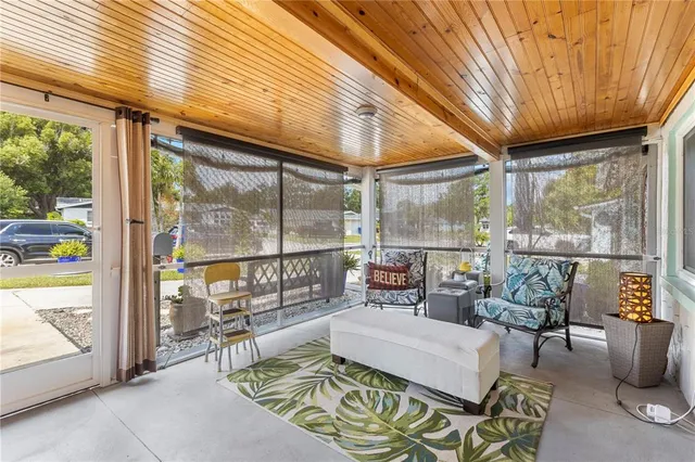 a view of a chair and table in backyard