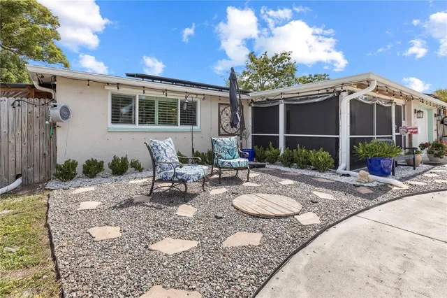 an aerial view of a house with garden space and lake view