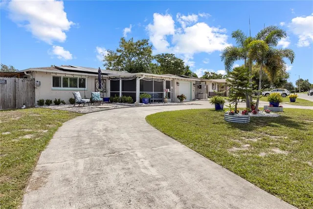 an aerial view of a house with outdoor space