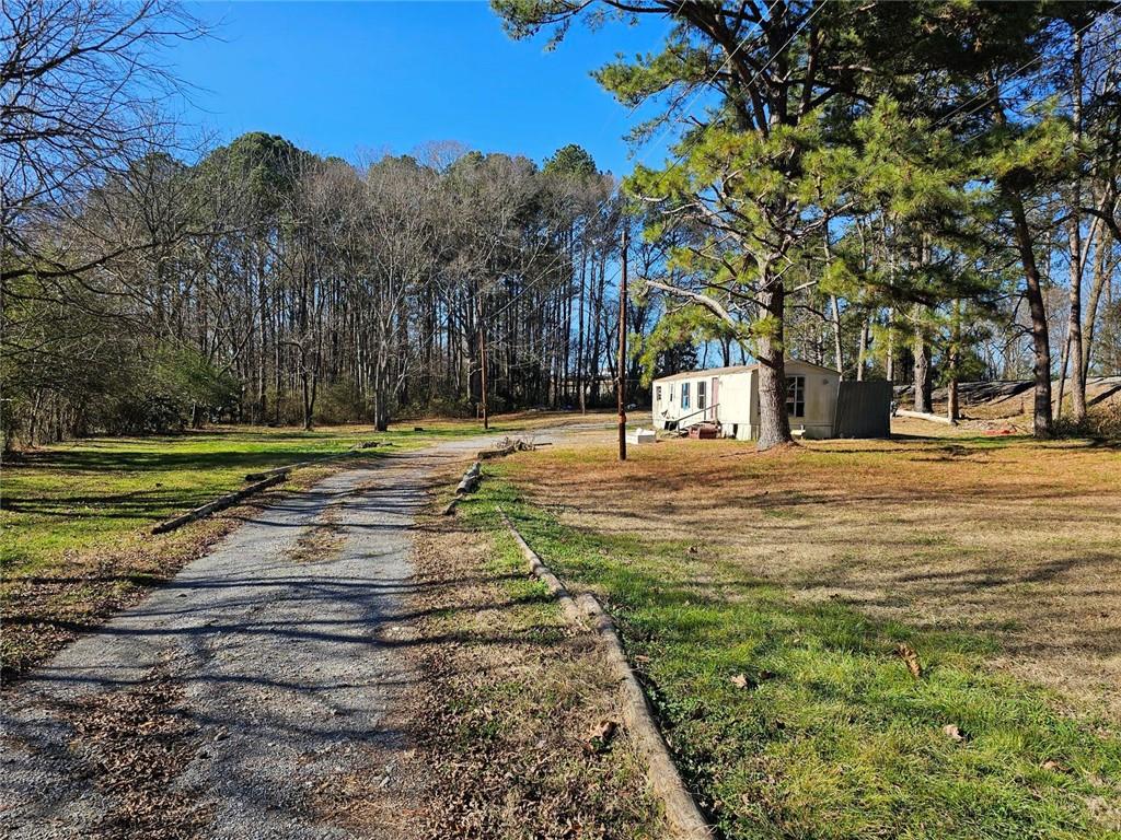 140 Old Cartersville Road Rockmart, GA 30153 - Photo 9 of 14 a swimming pool with trees in the background