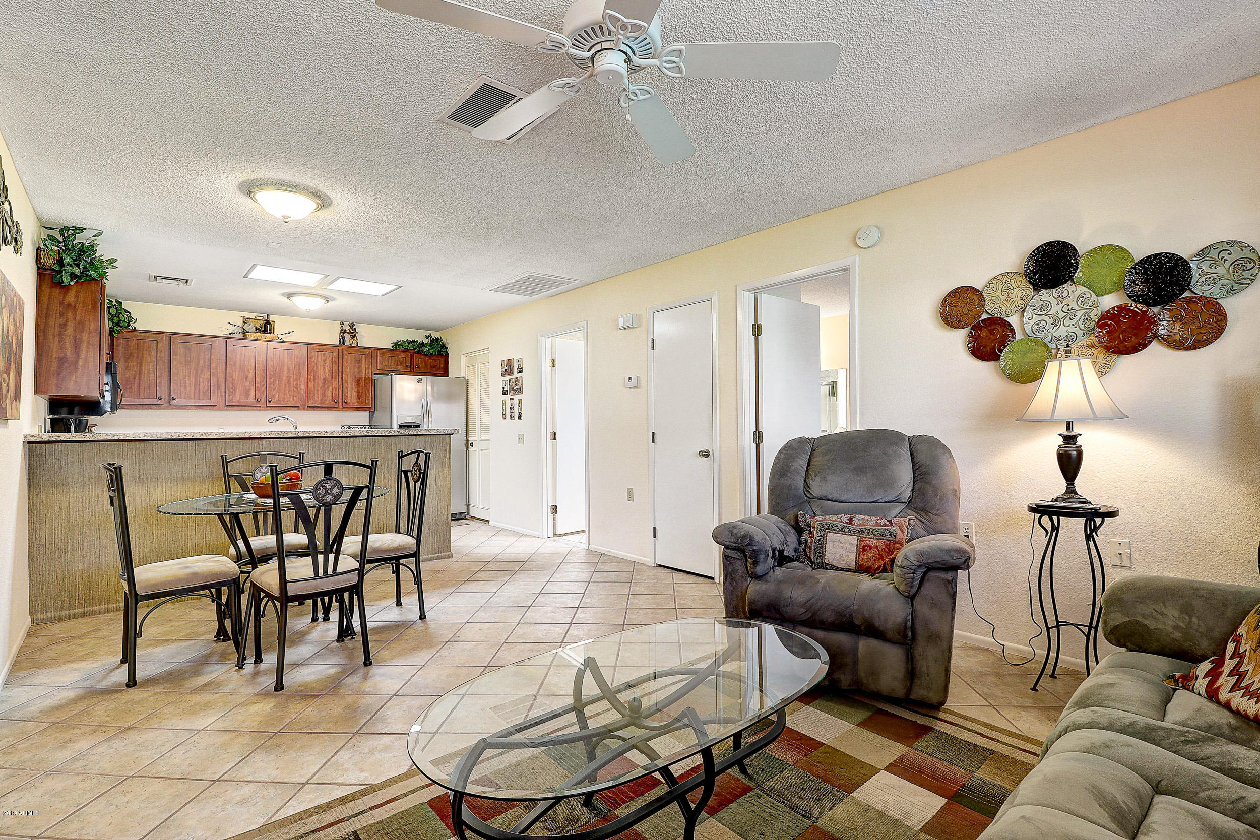 14300 West Bell Road, Unit 442 Surprise, AZ 85374 - Photo 3 of 44 Living Room, Dining Room, Kitchen View