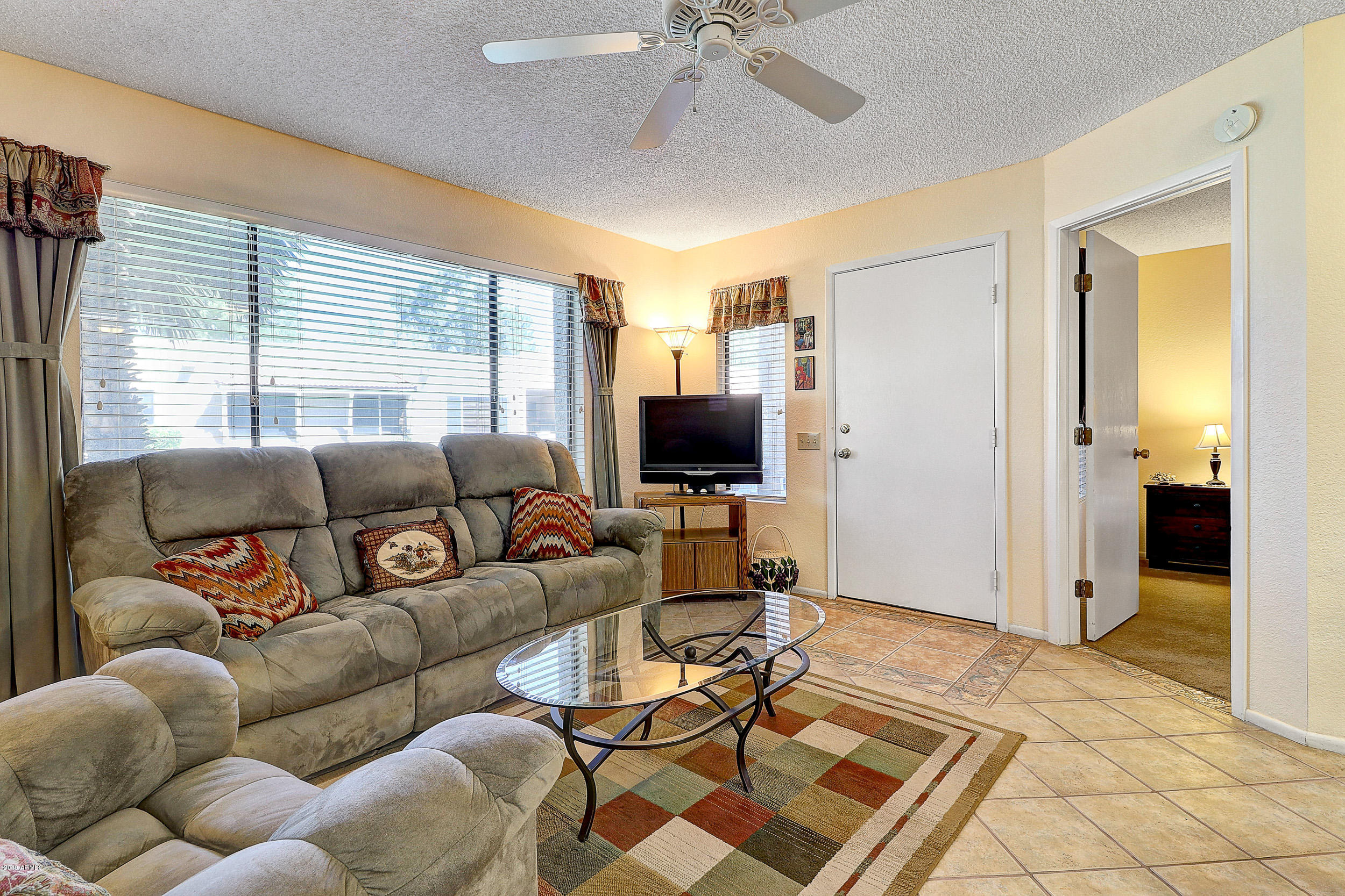 14300 West Bell Road, Unit 442 Surprise, AZ 85374 - Photo 4 of 44 Spacious Living Room With Tile Floors