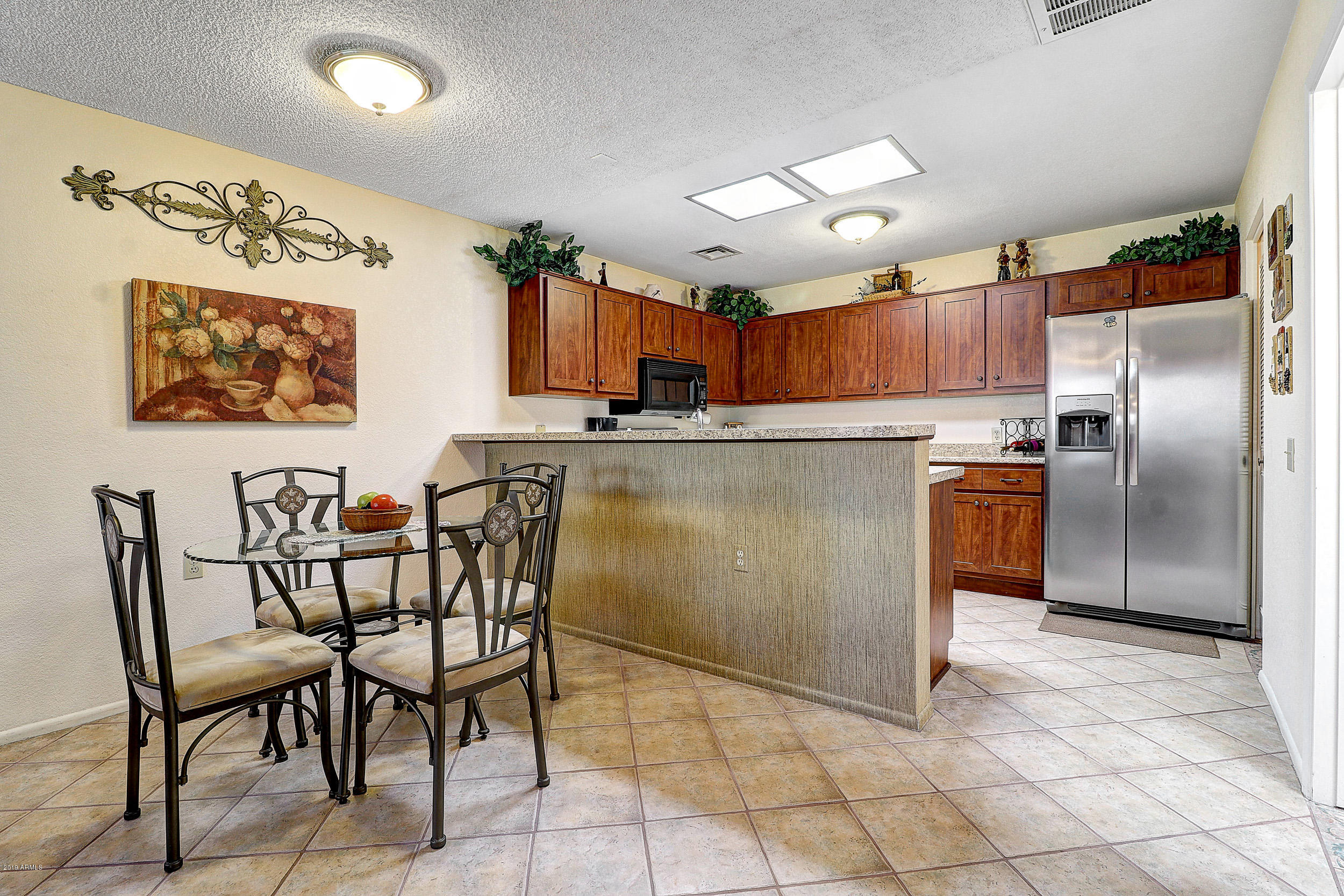 14300 West Bell Road, Unit 442 Surprise, AZ 85374 - Photo 9 of 44 Dining Room, Snack Bar, & Kitchen