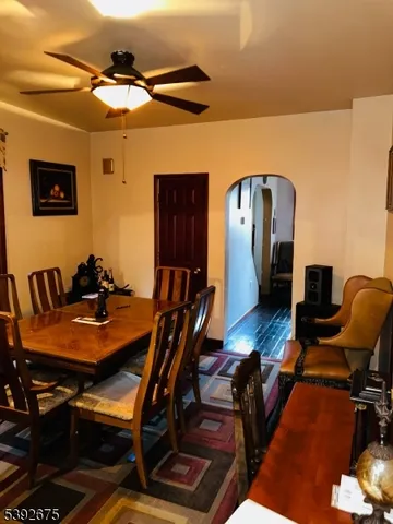 a dining room with furniture and wooden floor