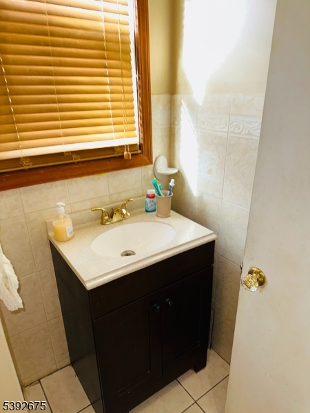 569 Cornell Street Perth Amboy, NJ 08861 - Photo 7 of 11 a bathroom with a sink and a mirror