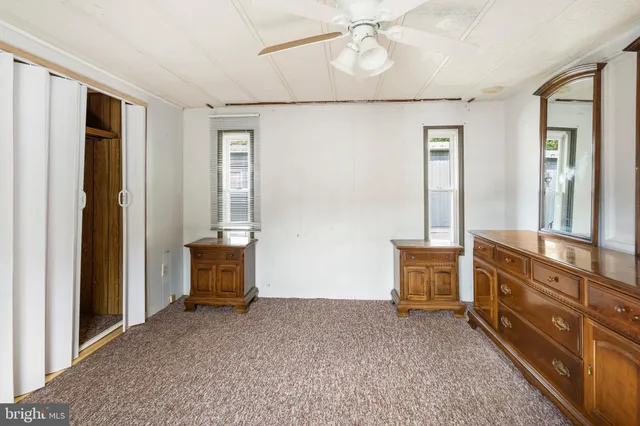 a view of room with furniture and a window