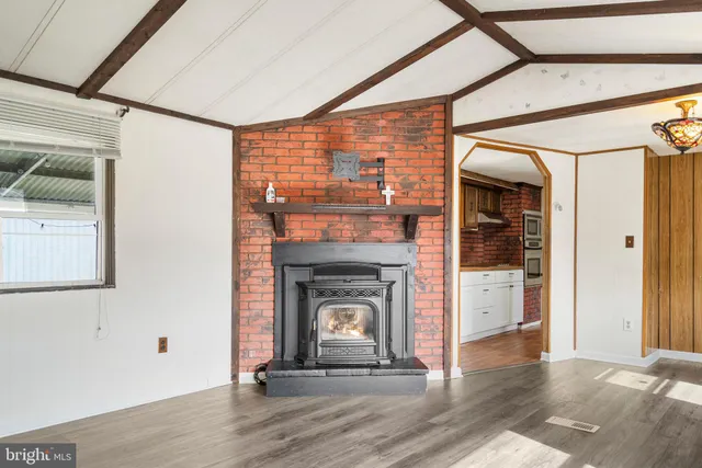 a living room with a fireplace and a floor