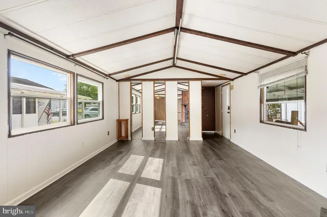 a view of an entryway with wooden floor