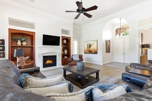 a kitchen with stainless steel appliances kitchen island granite countertop a table and chairs in it