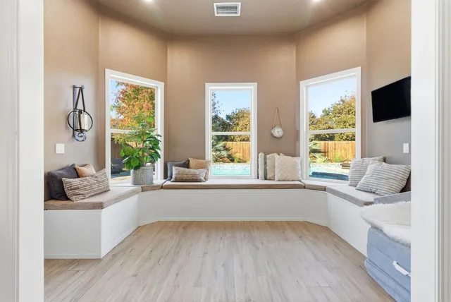 a living room with furniture and a bath tub