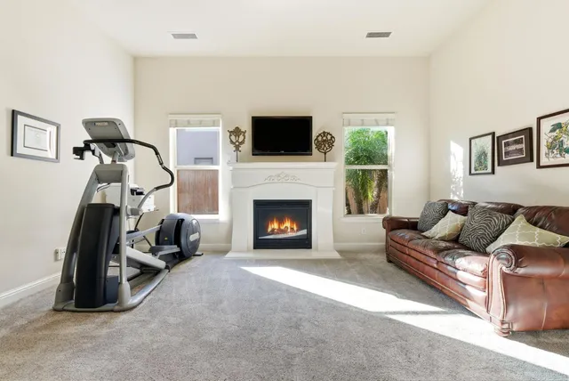 a kitchen with white cabinets and appliances