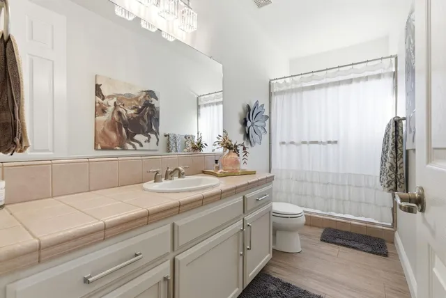 a bedroom with furniture and a window