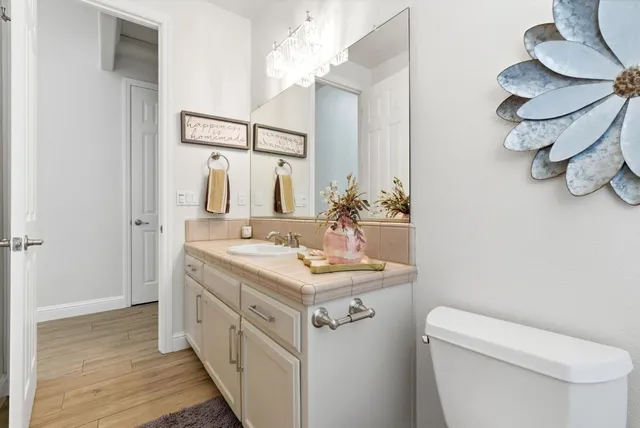 a bedroom with a bed and a dresser