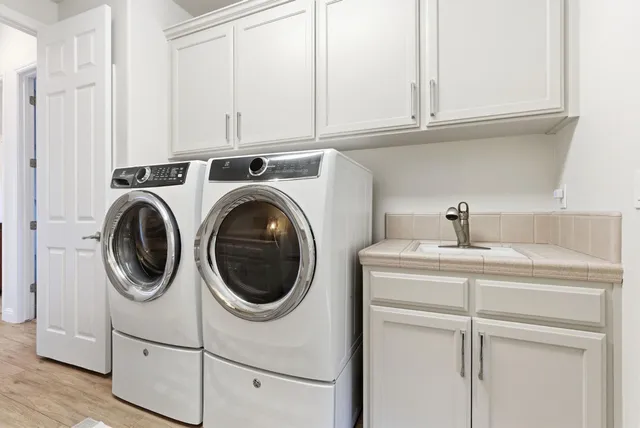 a bedroom with furniture and large windows