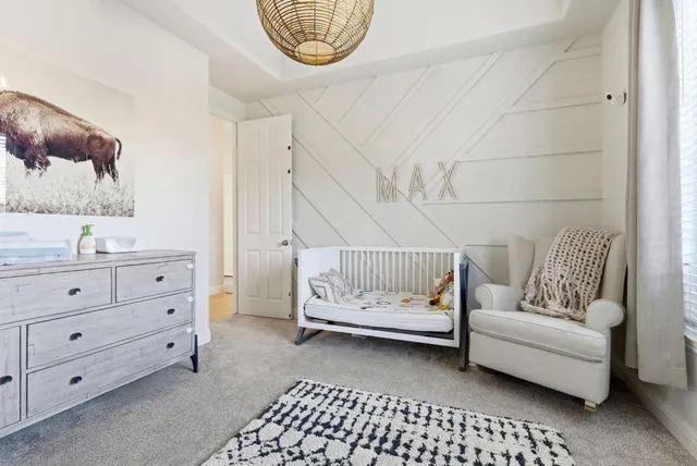 a bedroom with bed and window