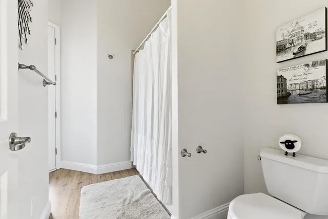 a bathroom with a tub sink and window