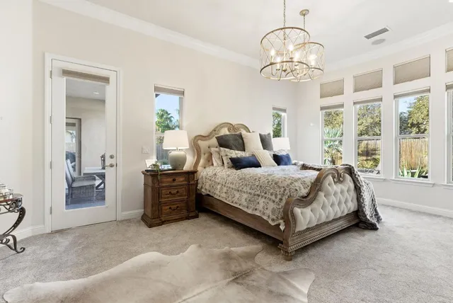 a view of a dining room with furniture one side and wooden floor