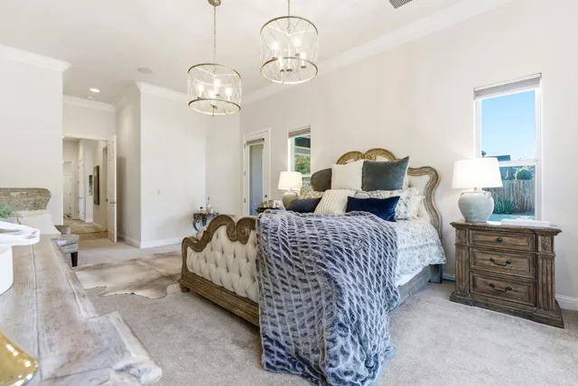 a view of a house with swimming pool and sitting area