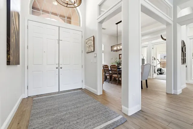 a living room with furniture ceiling fan and a rug