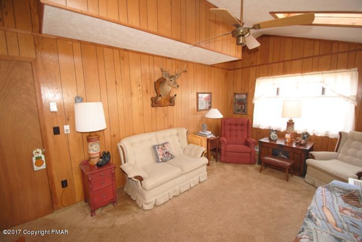 214 Elk Run Road Pocono Lake, PA 18347 - Photo 13 of 26 a living room with furniture and a window