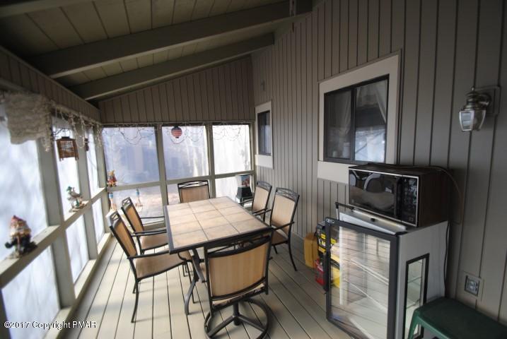 214 Elk Run Road Pocono Lake, PA 18347 - Photo 21 of 26 a dining room with furniture and window
