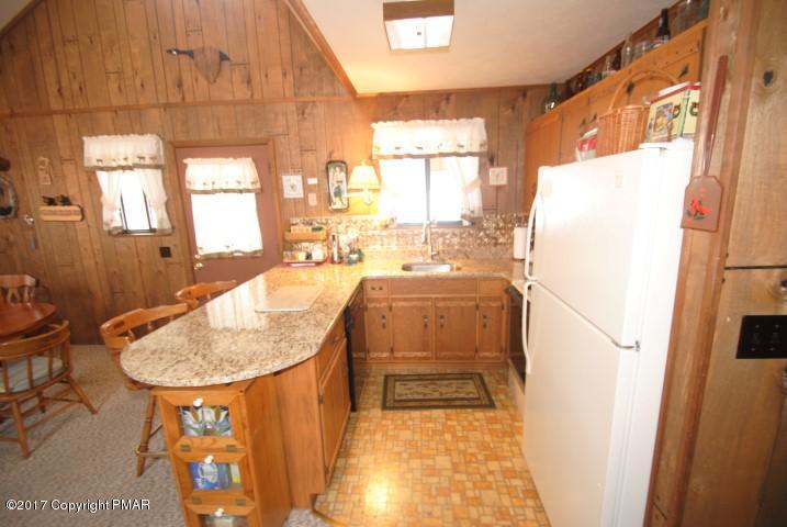 214 Elk Run Road Pocono Lake, PA 18347 - Photo 9 of 26 a room with a sink and a refrigerator