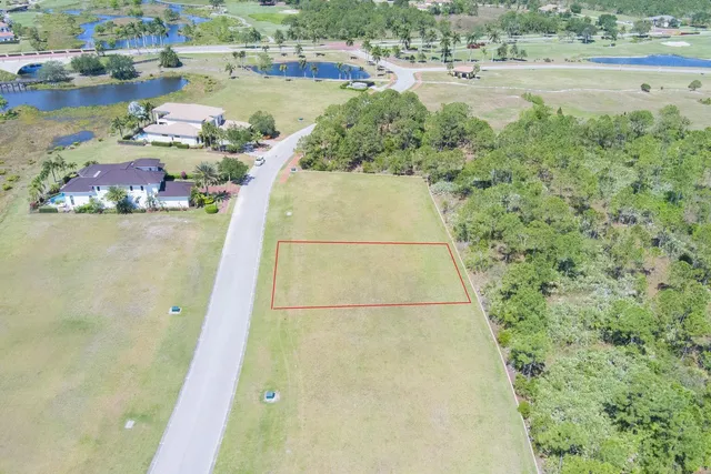 a view of a swimming pool with an outdoor space and seating area