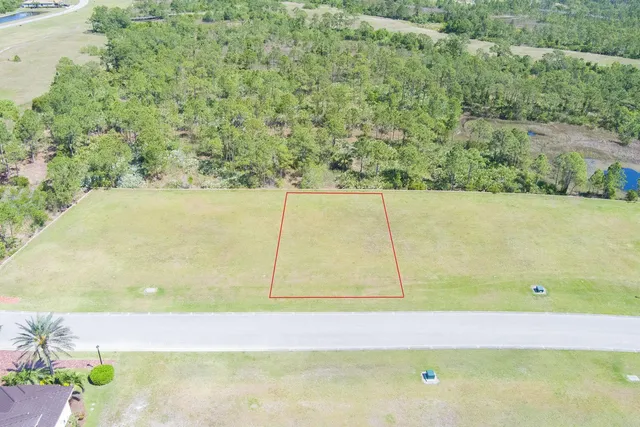 an aerial view of a residential houses with outdoor space