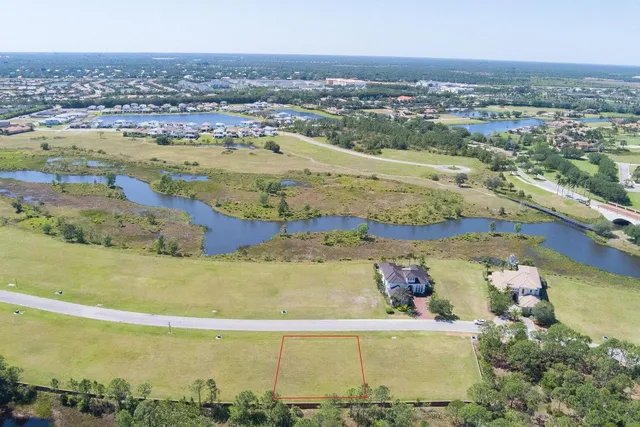 an aerial view of beach and residential houses with outdoor space