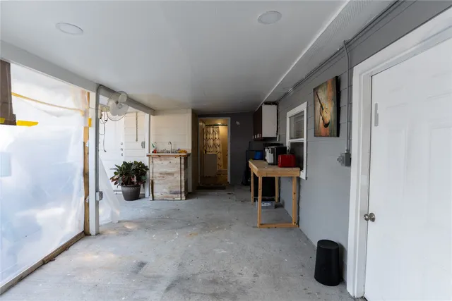 a view of living room with furniture and a window