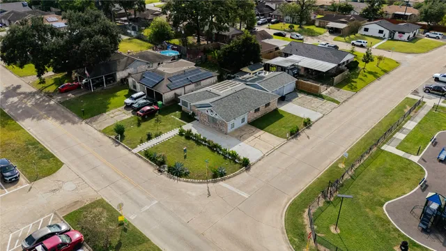 an aerial view of a house with outdoor space