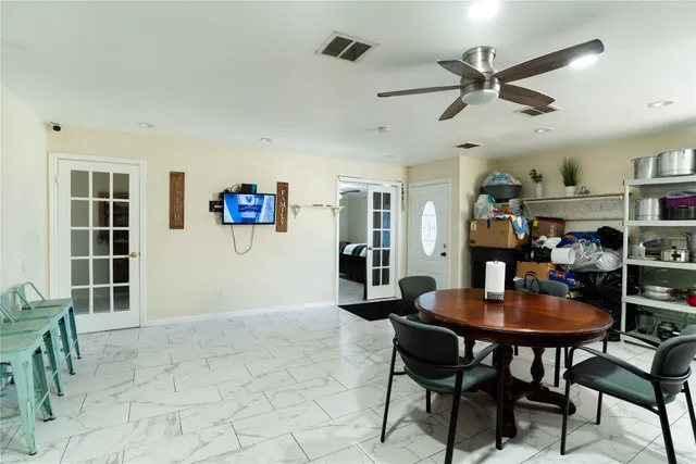 a dining room with furniture and window