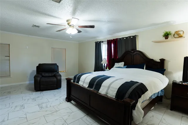 a bedroom with a bed and window